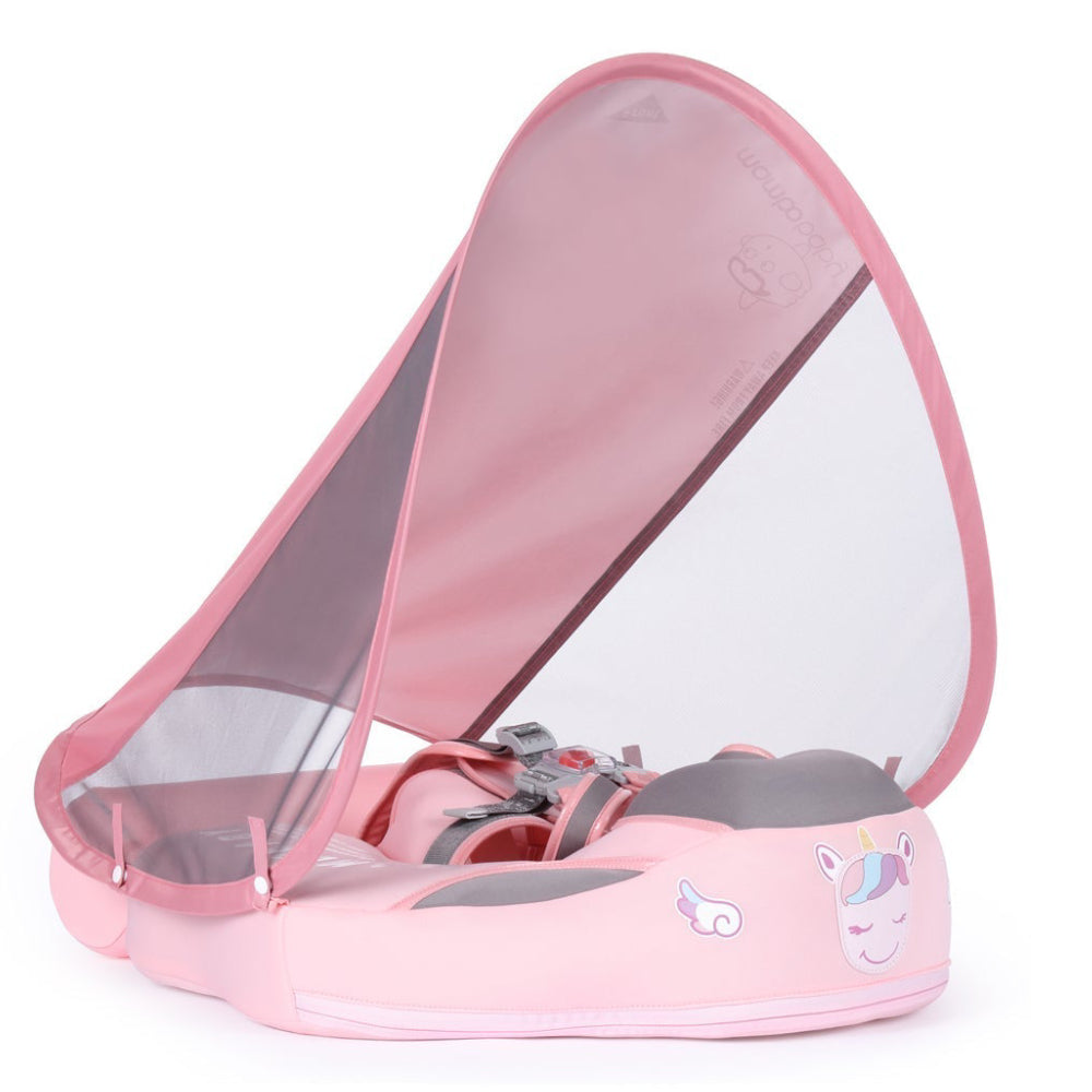 De roze Mambobaby™ Eenhoorn baby float (3-24 maanden). Luxe onzinkbare babyzwemband met afneembare UPF 50+ zonnekap en gepatenteerd 5-punts veiligheidsharnas voor veilig waterplezier.